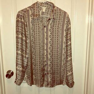 Patterned black and silver silky blouse.